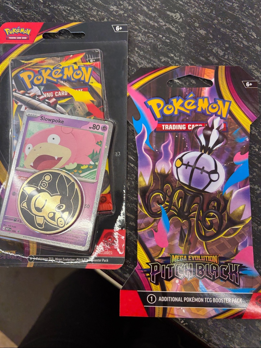 Pokemon Pink and Purple Slowpoke Coin & Pitch Black Booster Pack